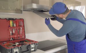 Commercial kitchen hood cleaning service in action