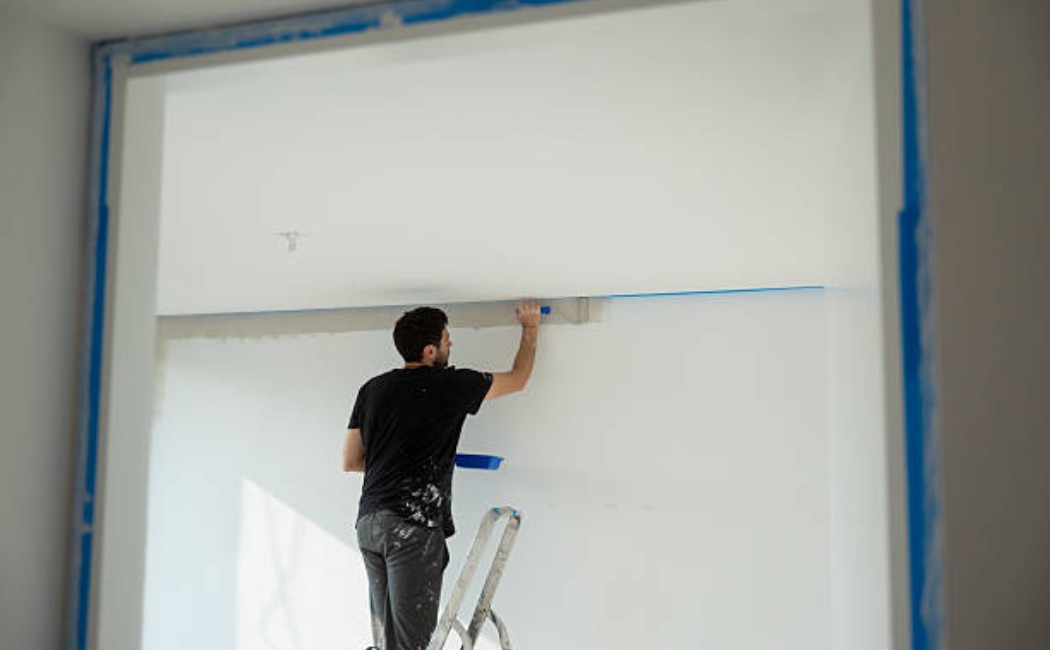 Renovation worker applying wall filler