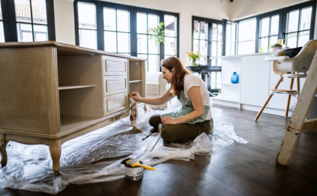 istockphoto-1279270723-612x612_1050x650_q90 (1) Young woman repairing old wooden furniture at home.